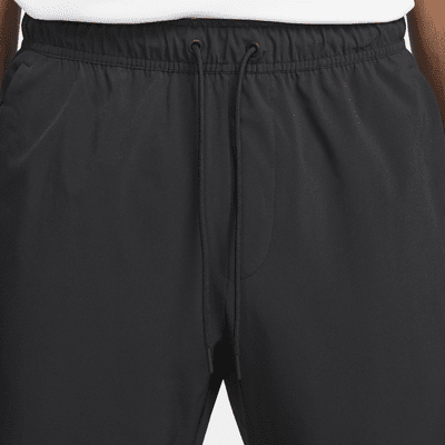 Nike Nike UnlimitedPantalón versátil con bajos con cremallera Dri-FIT ADV - Hombre Promoción por tiempo limitado