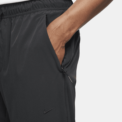 Nike Nike UnlimitedPantalón versátil con bajos con cremallera Dri-FIT ADV - Hombre Promoción por tiempo limitado