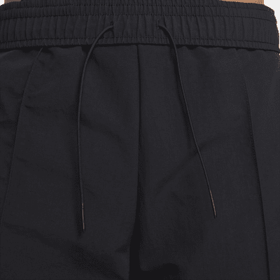Nike Nike Sportswear Everything WovensPantalón de talle medio con dobladillo abierto - Mujer Últimos 3 días
