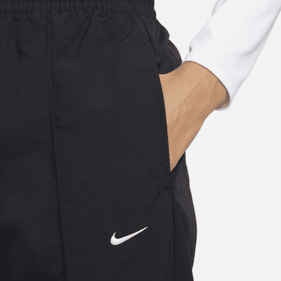 Nike Nike Sportswear Everything WovensPantalón de talle medio con dobladillo abierto - Mujer Últimos 3 días